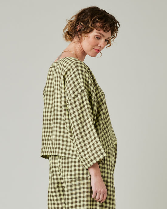 pregnant model wears matcha gingham linen lily 