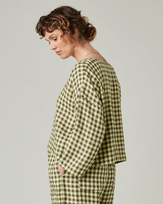 pregnant model wears matcha gingham linen lily 