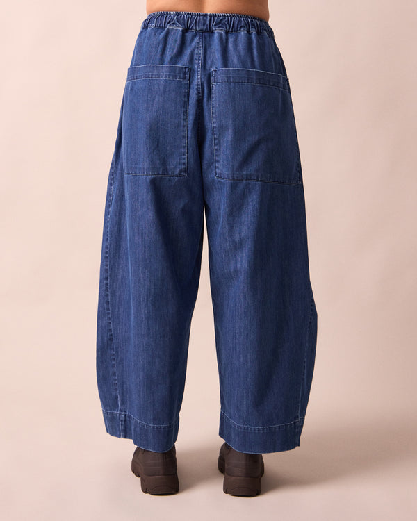 model wears mathilde mid blue denim jeans back