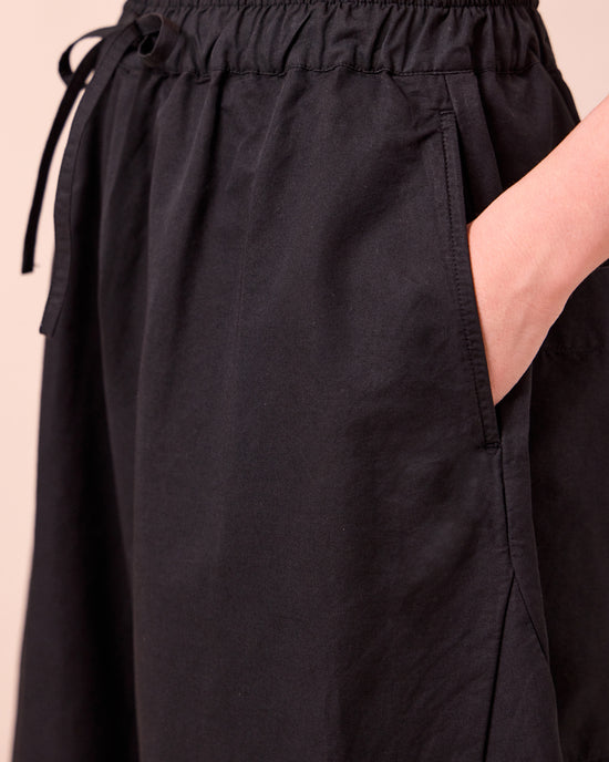 model wears mathilde black cotton linen trousers