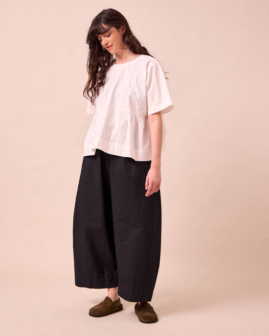 model wears mathilde black cotton linen trousers right