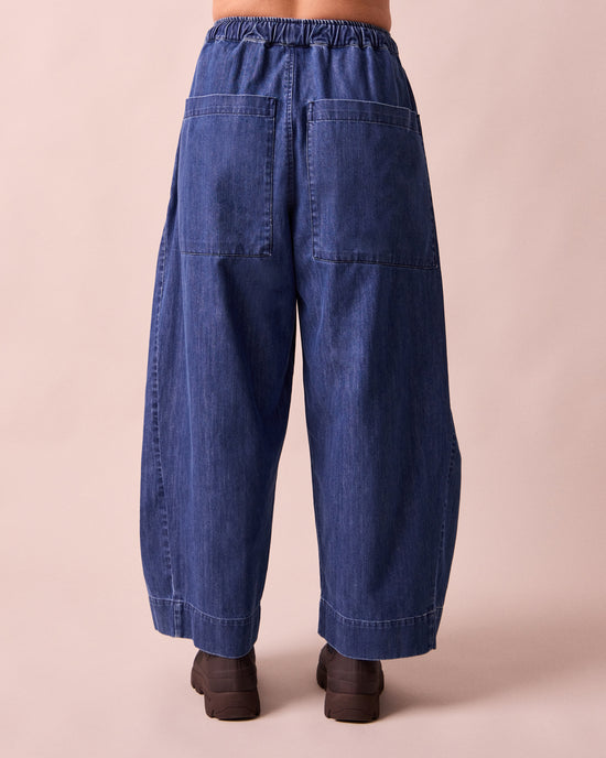 model wears mathilde mid blue denim jeans back