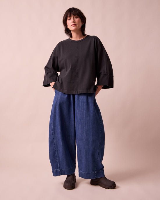 model wears mathilde mid blue denim jeans right