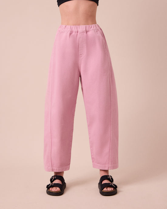 model wears maeve orchid pink denim jeans front