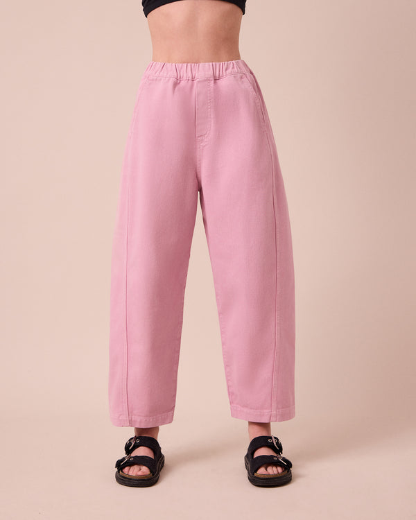 model wears maeve orchid pink denim jeans front