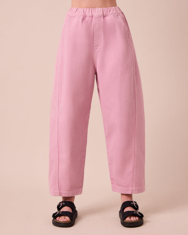 model wears maeve orchid pink denim jeans front