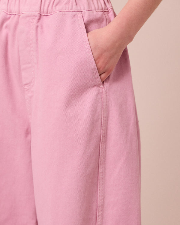 model wears maeve orchid pink denim jeans