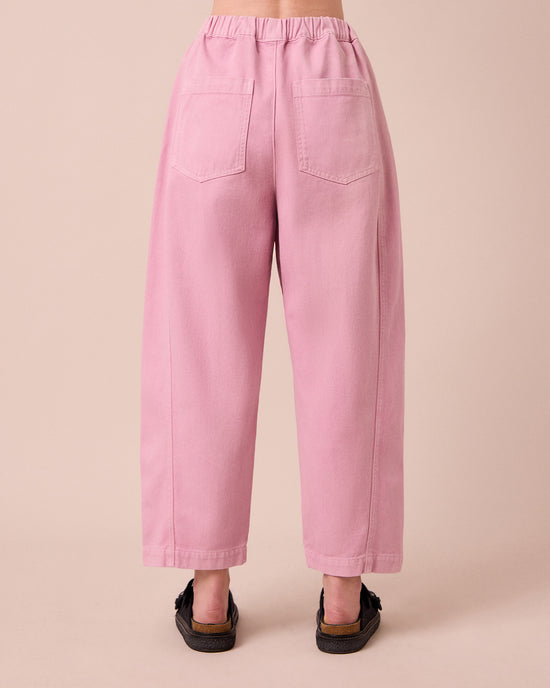 model wears maeve orchid pink denim jeans back