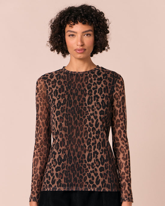 model wears dark leopard mesh top