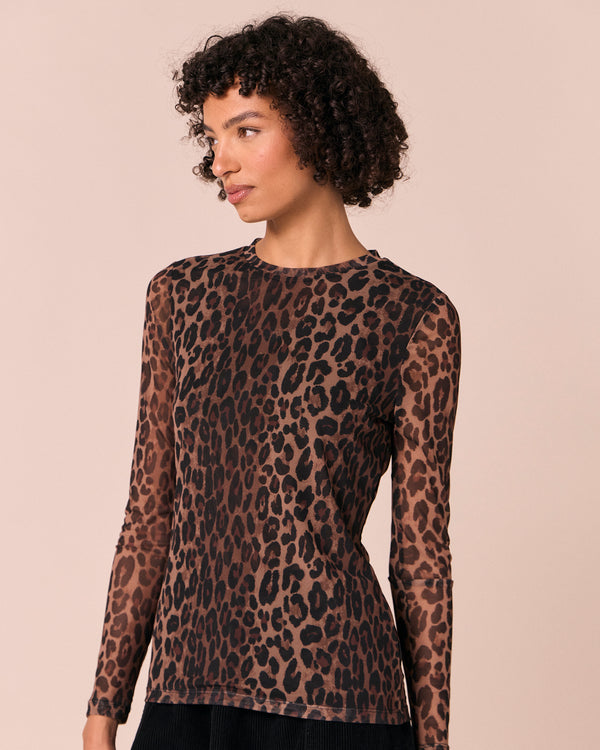 model wears dark leopard mesh top
