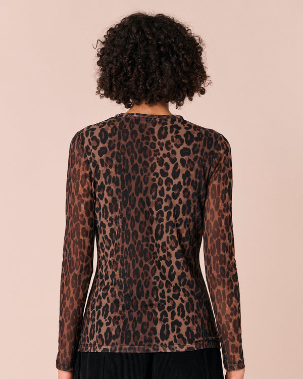 model wears dark leopard mesh top