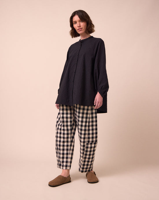 model wears mia black shirt