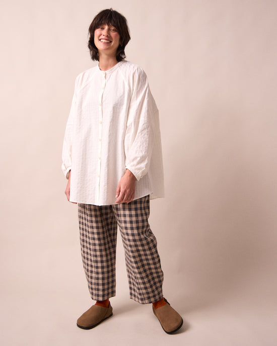 model wears mia white cotton shirt