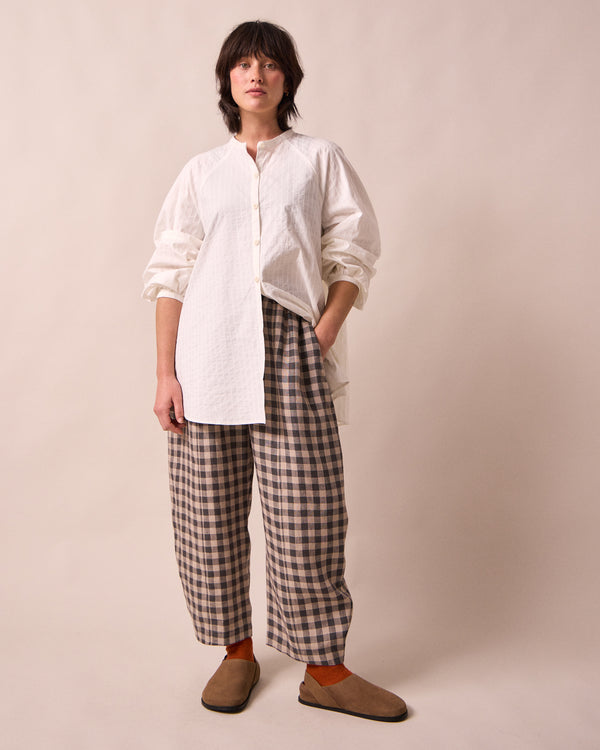 model wears mia white cotton shirt