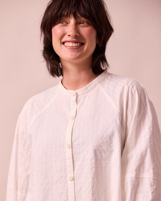 model wears mia white cotton shirt