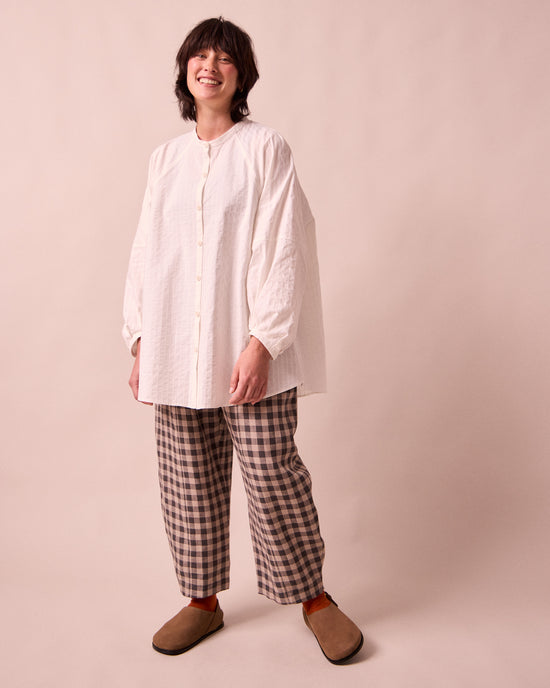 model wears mia white cotton shirt