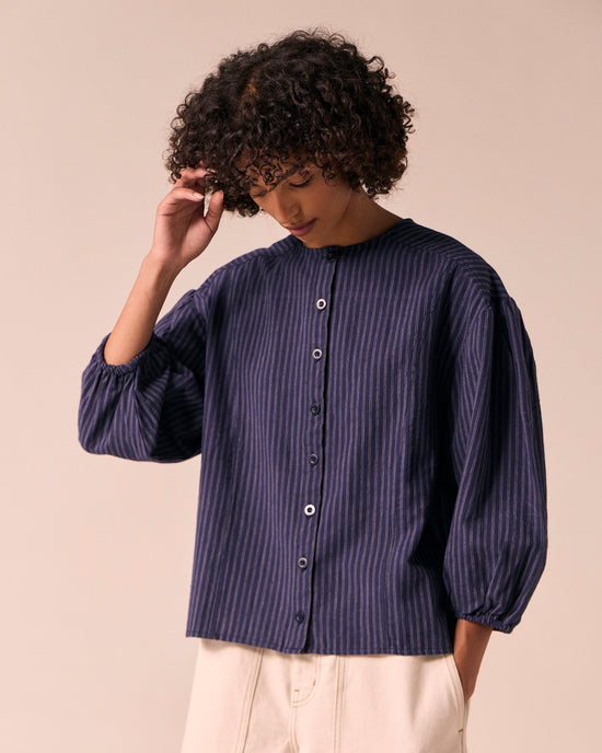 model wears miley midnight pinstripe cotton linen top