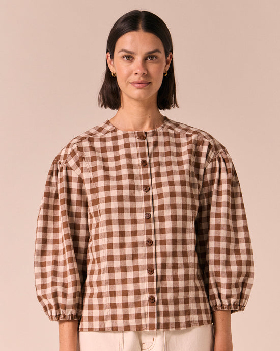 model wears miley toffee check cotton linen top
