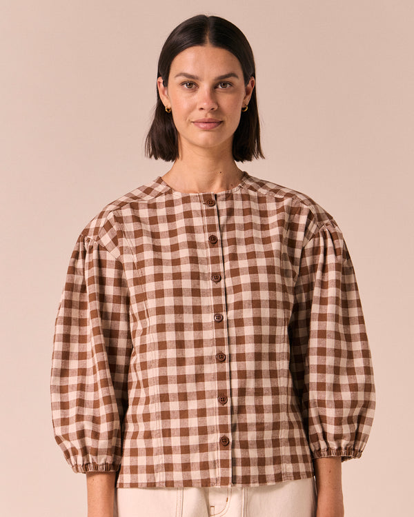 model wears miley toffee check cotton linen top