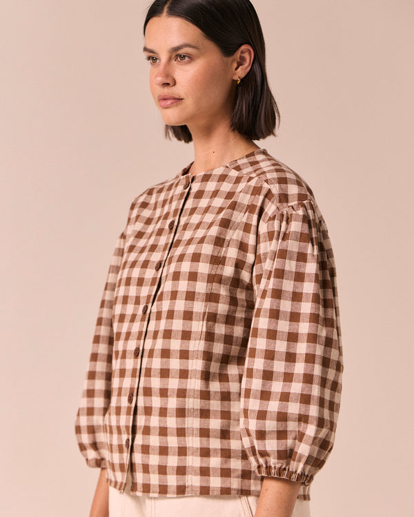 model wears miley toffee check cotton linen top