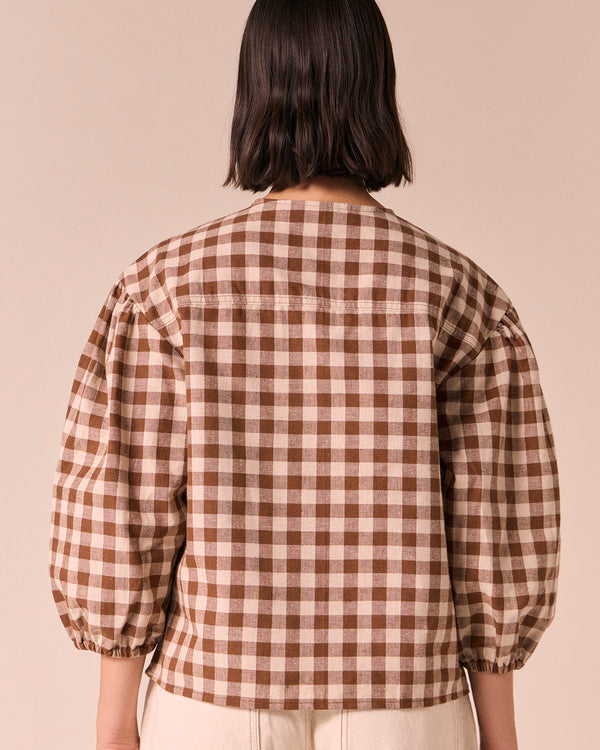 model wears miley toffee check cotton linen top