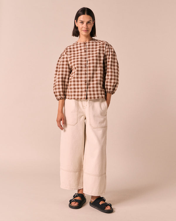 model wears miley toffee check cotton linen top