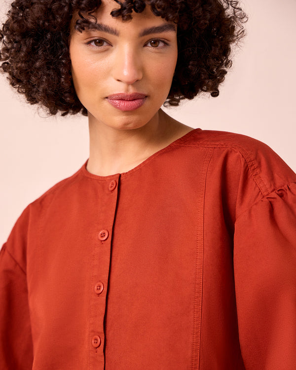model wears miley paprika cotton linen top