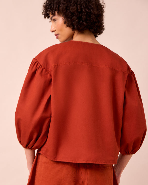 model wears miley paprika cotton linen top
