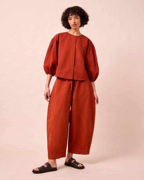 model wears miley paprika cotton linen top