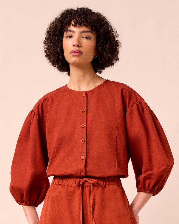 model wears miley paprika cotton linen top