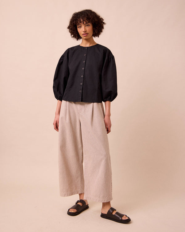 model wears miley washed black cotton linen top