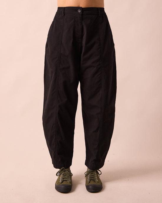 model wears millie black heavy cotton trousers front