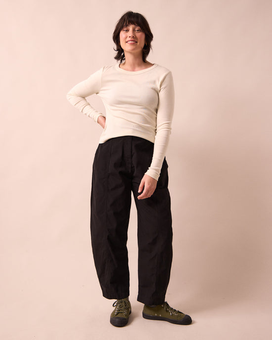 model wears millie black heavy cotton trousers right