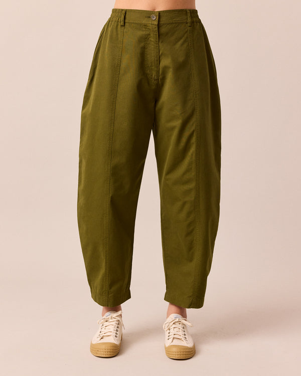 model wears millie dark olive cotton trousers front