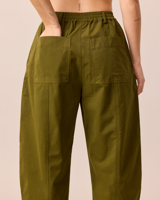 model wears millie dark olive cotton trousers