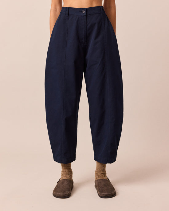 model wears millie navy cotton trousers front