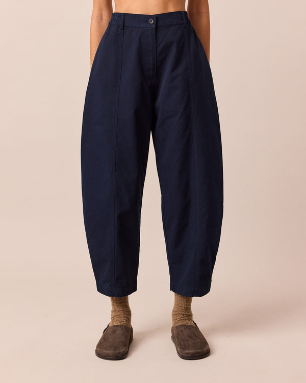 model wears millie navy cotton trousers front