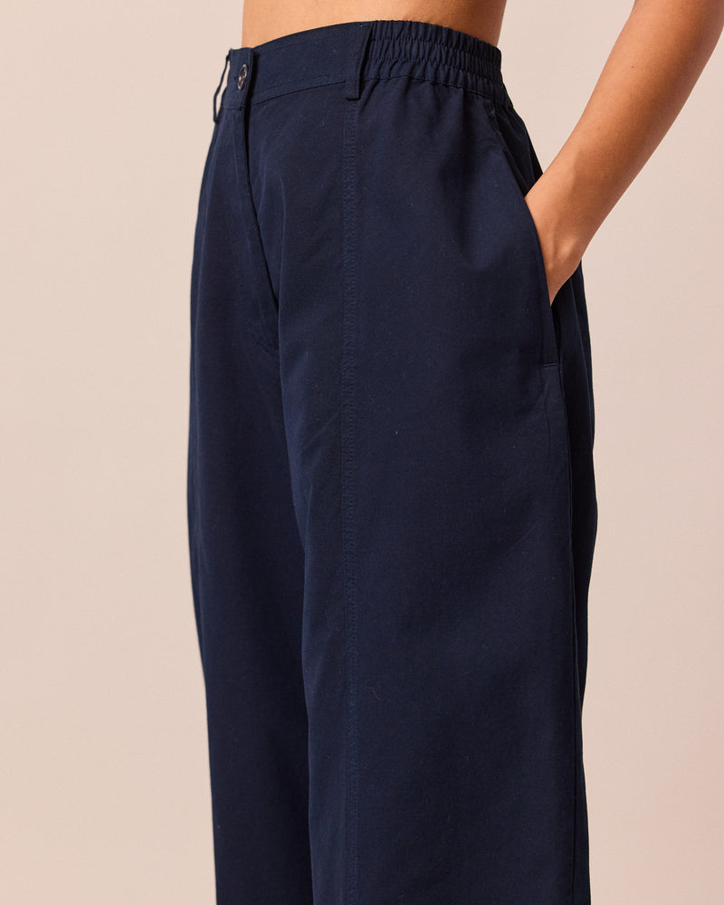 model wears millie navy cotton trousers