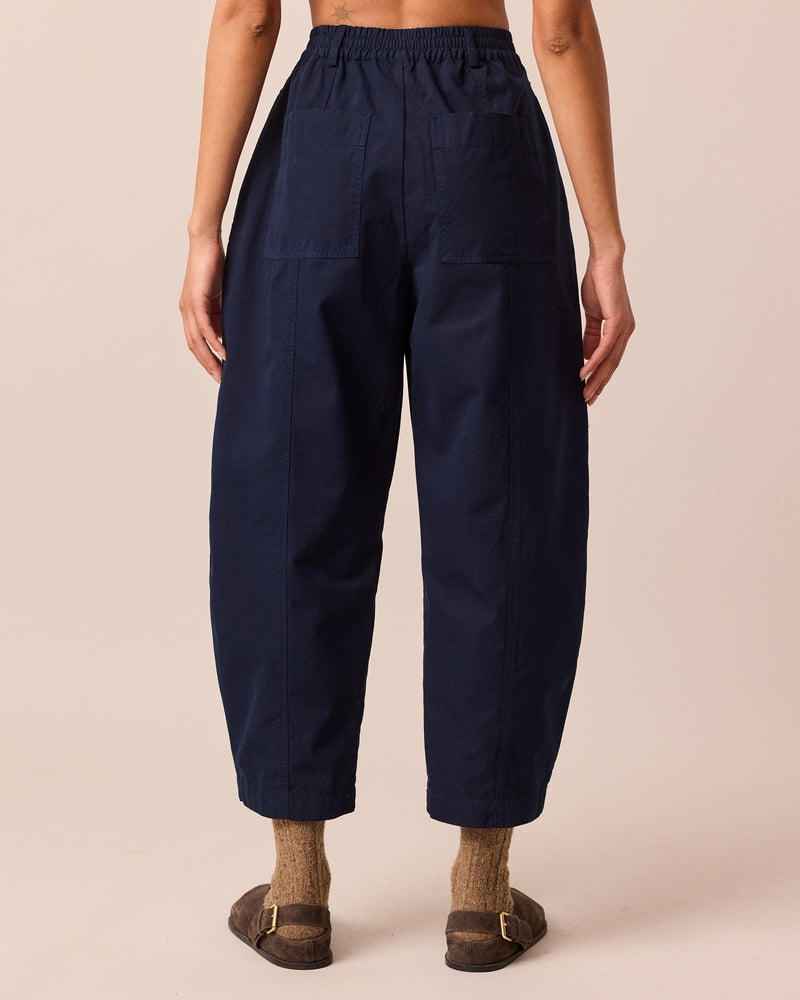 model wears millie navy cotton trousers back