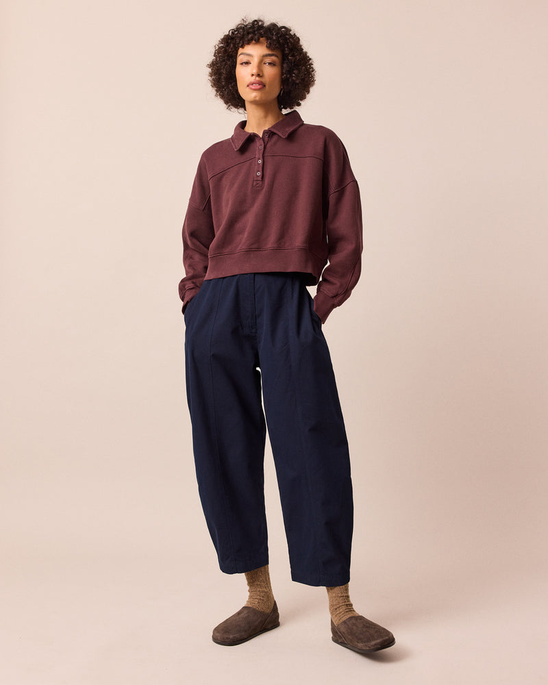 model wears millie navy cotton trousers left