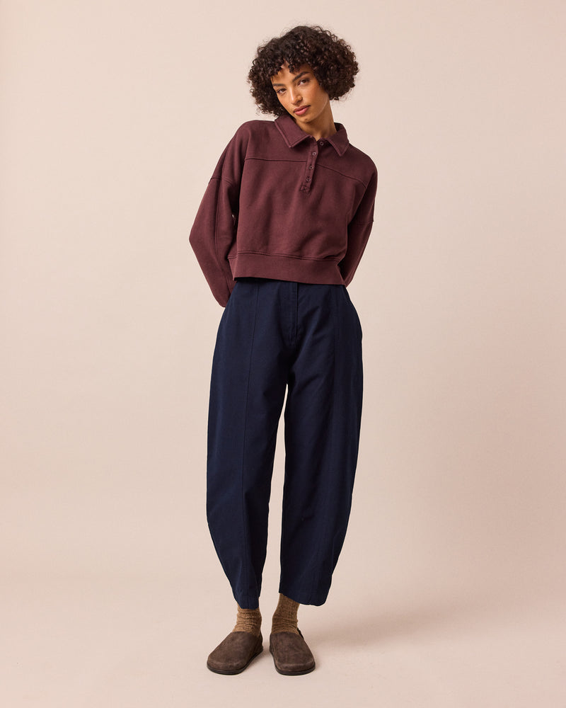model wears millie navy cotton trousers right