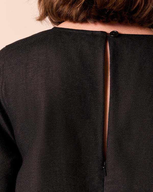 model wears molly black linen jumpsuit