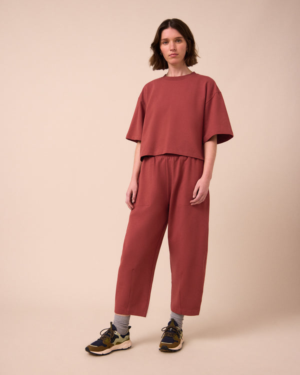 model wears nicole brick jersey top