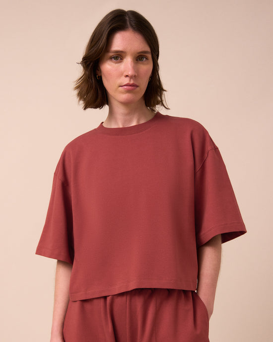 model wears nicole brick jersey top