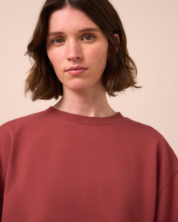 model wears nicole brick jersey top