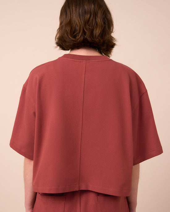 model wears nicole brick jersey top