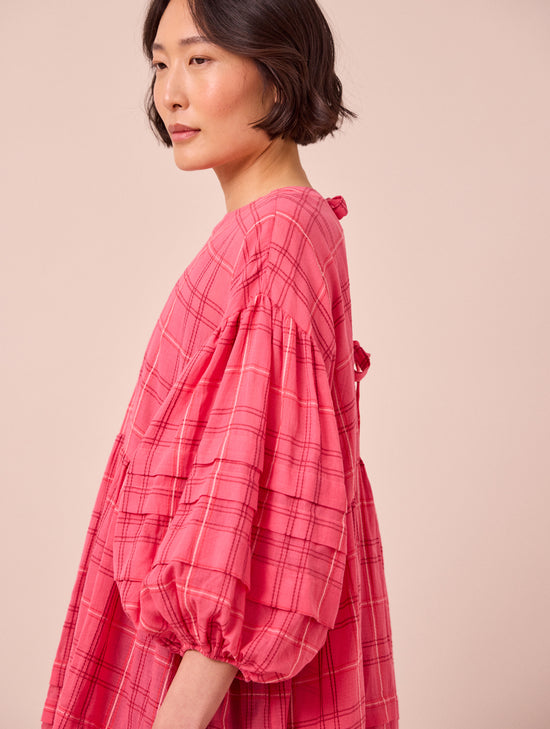 model wears nina hot pink cotton gauze dress