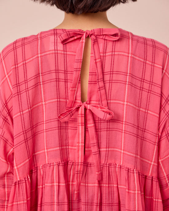 model wears nina hot pink cotton gauze dress