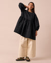 model wears nina black self stripe cotton dress