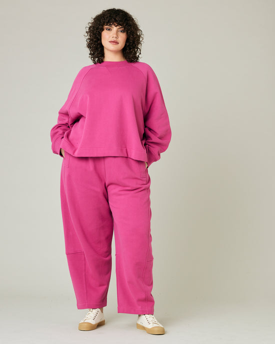 model wears cactus pink noa jumper and madi trousers